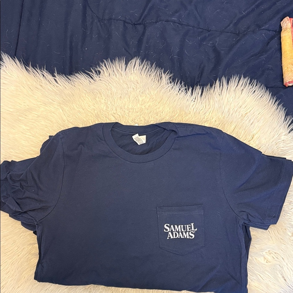Sam Adams logo on front pocket. Back is blank.